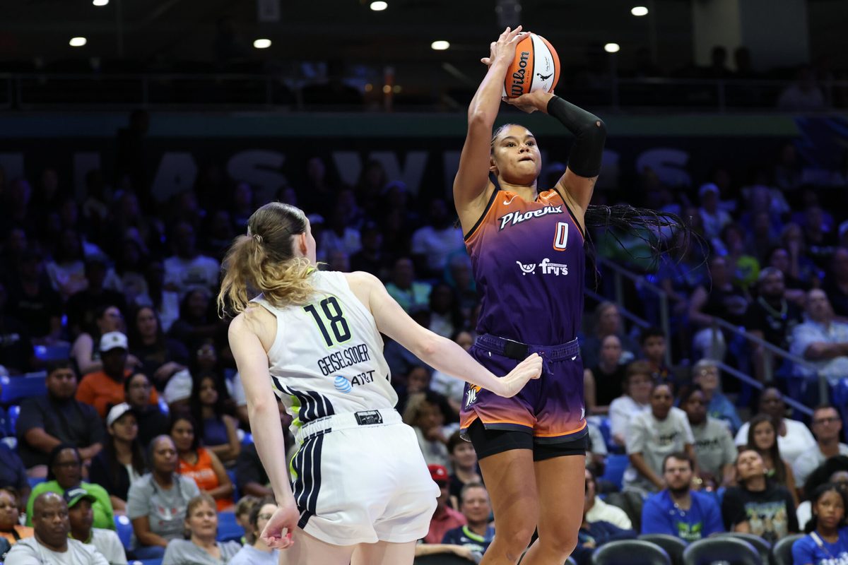 Jul 3, 2025; Arlington, Texas, USA; Phoenix Mercury forward Satou Sabally (0) shoots over Dallas Wings center Luisa Geiselsoder (18) during the second half at College Park Center. Mandatory Credit: Kevin Jairaj-Imagn Images