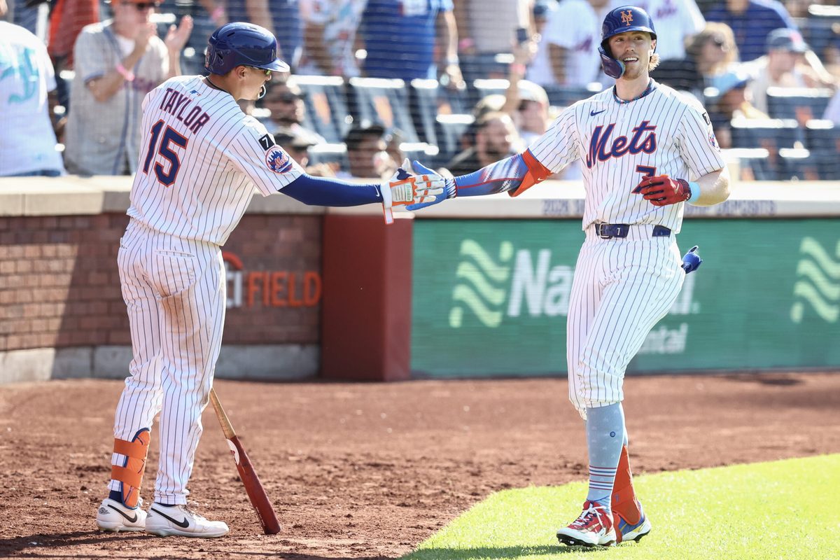 Jul 4, 2025; New York City, New York, USA; New York Mets third baseman Brett Baty (7) is greeted by center fielder Tyrone Taylor (15) after hitting a solo home run in the sixth inning against the New York Yankees at Citi Field. Mandatory Credit: Wendell Cruz-Imagn Images