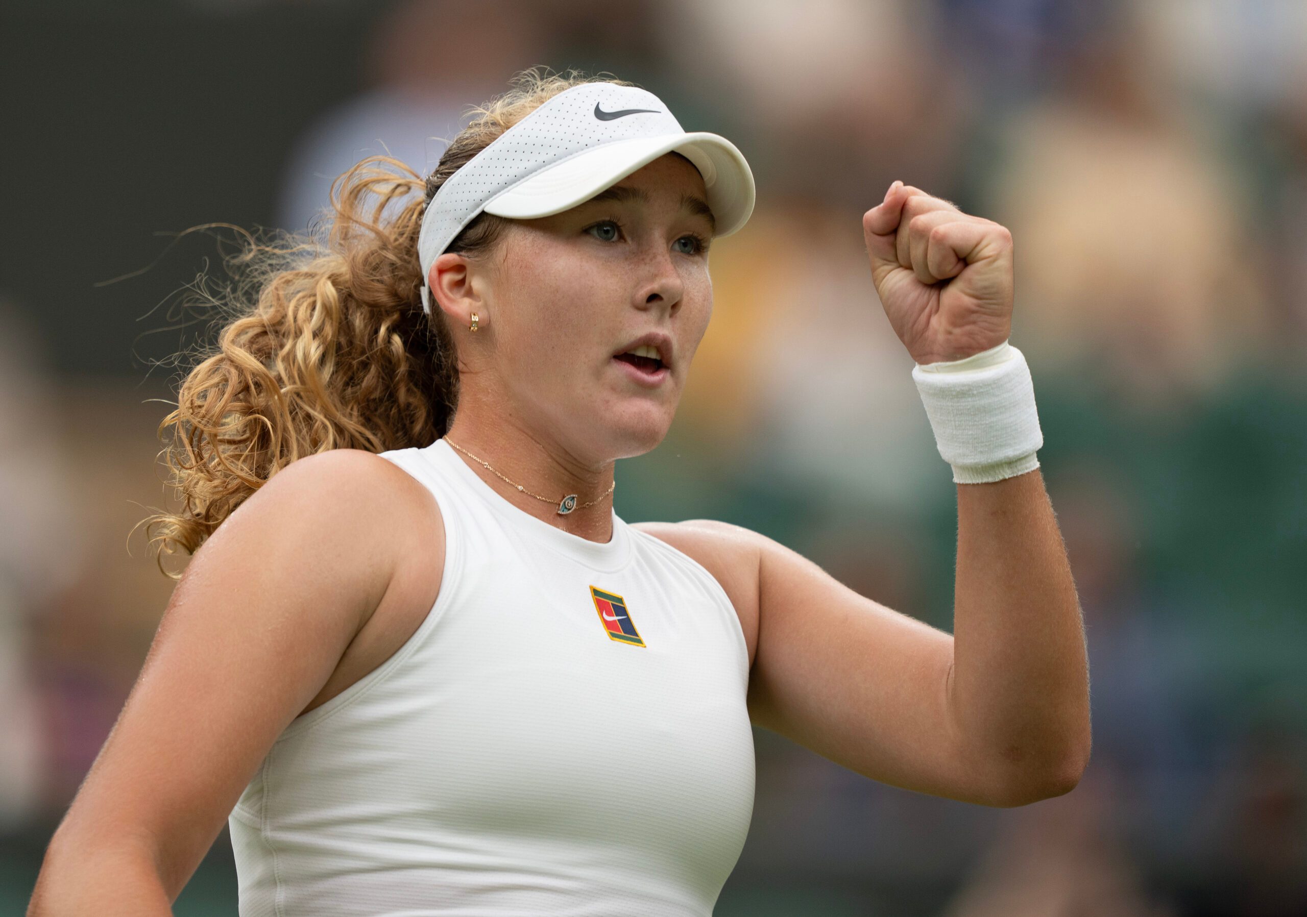 Jul 5, 2025; Wimbledon, United Kingdom; Mirra Andreeva reacts to a point during her match against Hailey Baptiste of the United States on day six at the All England Lawn Tennis and Croquet Club. Mandatory Credit: Susan Mullane-Imagn Images