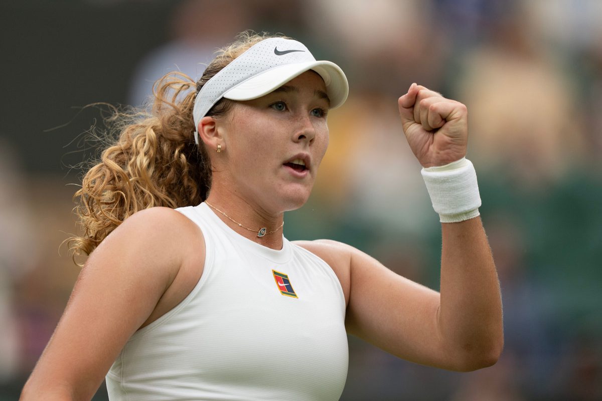 Jul 5, 2025; Wimbledon, United Kingdom;  Mirra Andreeva reacts to a point during her match against Hailey Baptiste of the United States on day six at the All England Lawn Tennis and Croquet Club. Mandatory Credit: Susan Mullane-Imagn Images