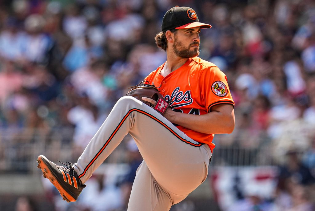 Jul 5, 2025; Cumberland, Georgia, USA; Baltimore Orioles starting pitcher Dean Kremer (64) pitches against the Atlanta Braves during the first inning at Truist Park. Mandatory Credit: Dale Zanine-Imagn Images