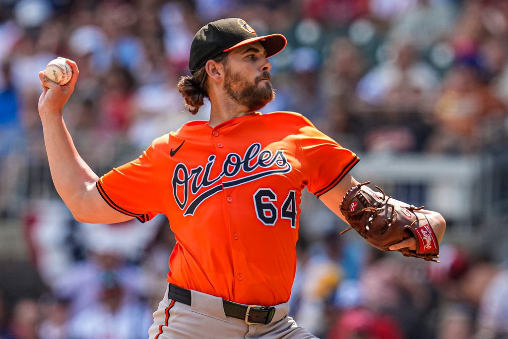 Jul 5, 2025; Cumberland, Georgia, USA; Baltimore Orioles starting pitcher Dean Kremer (64) pitches against the Atlanta Braves during the first inning at Truist Park. Mandatory Credit: Dale Zanine-Imagn Images