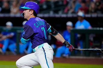 Diamondbacks outfielder Corbin Carroll (7) hits a ball in the third inning against the Royals during a game in Phoenix, at Chase Field on July 5, 2025.