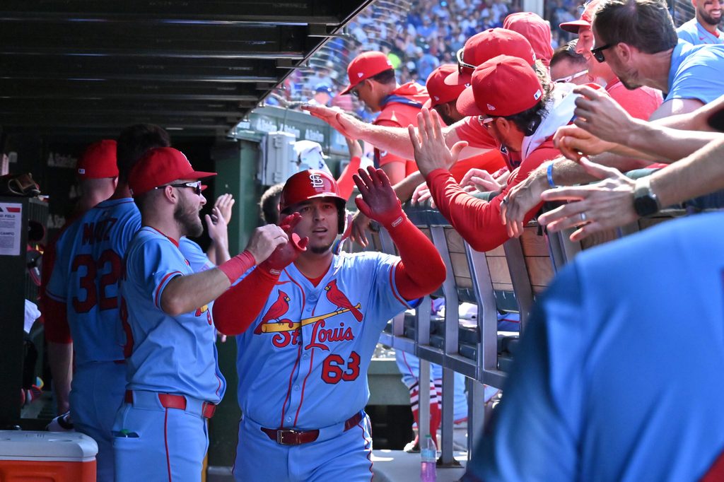 Jul 5, 2025; Chicago, Illinois, USA; St. Louis Cardinals pinch hitter Yohel Pozo (63) celebrates with teammates in the dugout after hitting a three-run home run during the eighth inning against the Chicago Cubs at Wrigley Field. Mandatory Credit: Patrick Gorski-Imagn Images