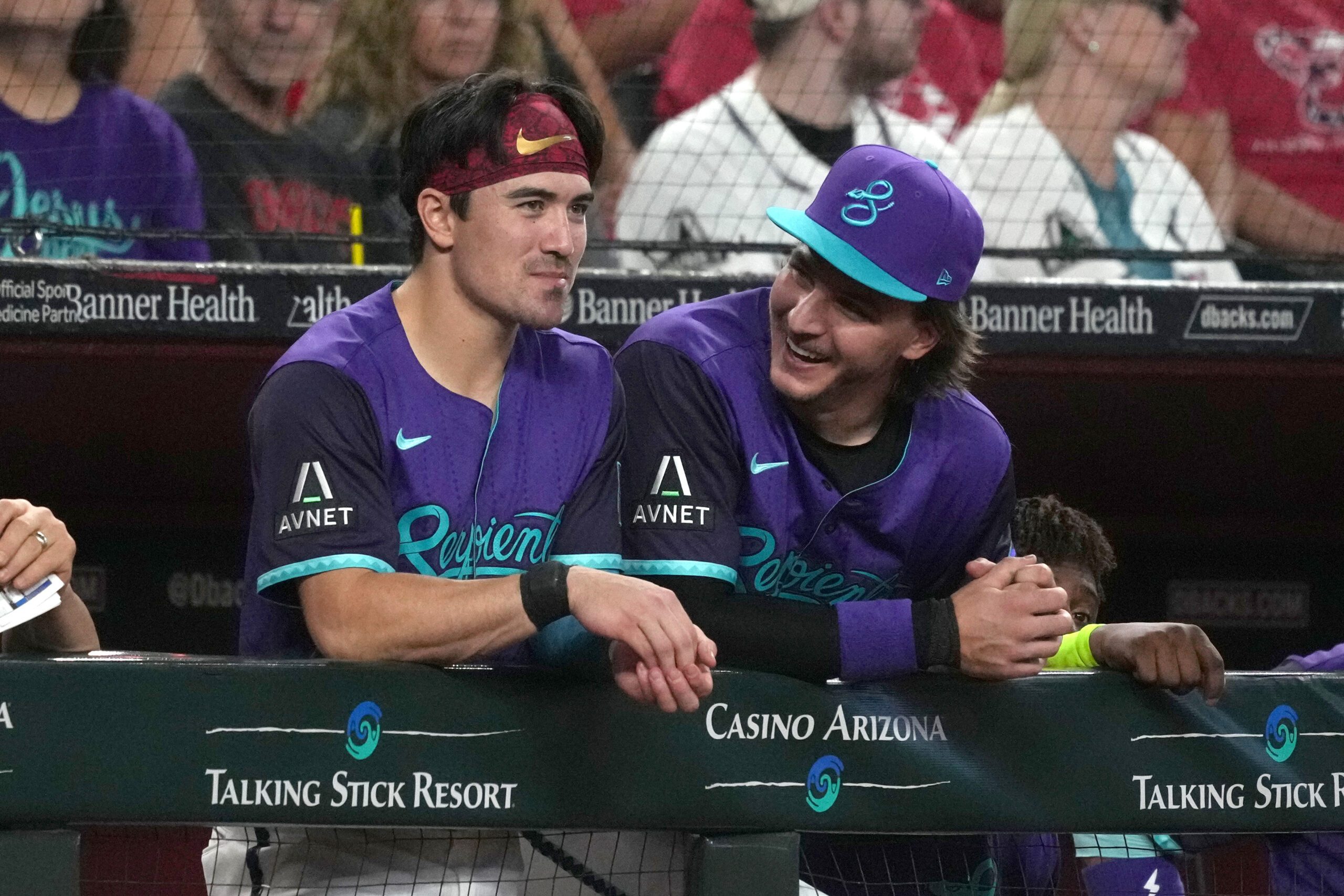Jul 5, 2025; Phoenix, Arizona, USA; Arizona Diamondbacks outfielder Corbin Carroll (7) and  pitcher Brandon Pfaadt (32) talk against the Kansas City Royals in the first inning at Chase Field. Mandatory Credit: Rick Scuteri-Imagn Images