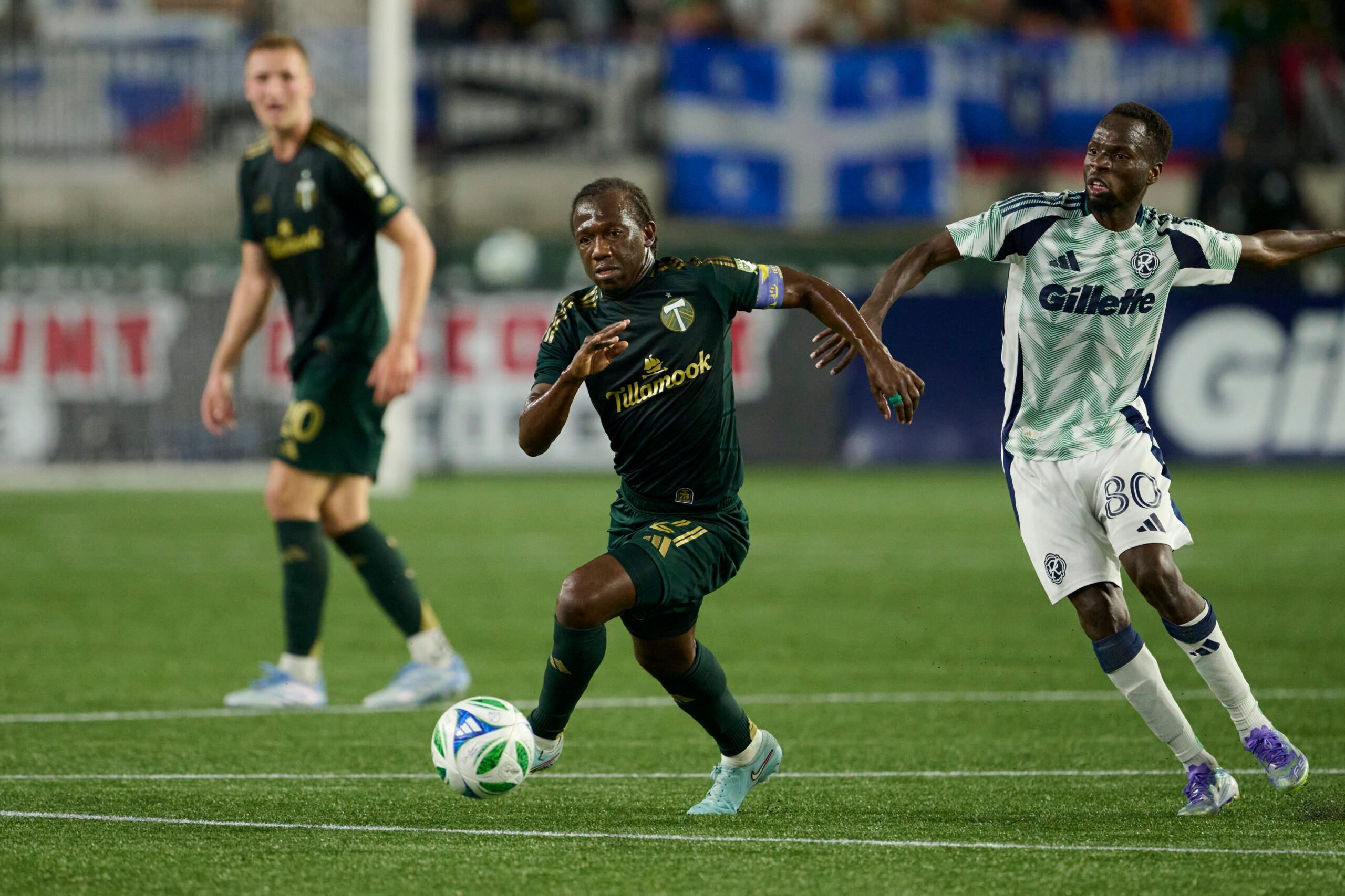 Jul 5, 2025; Portland, Oregon, USA; Portland Timbers midfielder Diego Chara (21) controls the ball during the second half against New England Revolution midfielder Alhassan Yusuf (80) at Providence Park. Mandatory Credit: Troy Wayrynen-Imagn Images