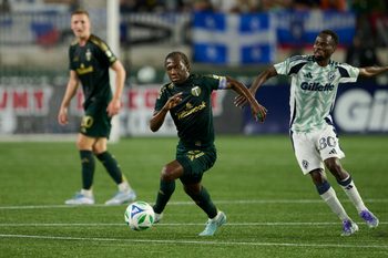 Jul 5, 2025; Portland, Oregon, USA; Portland Timbers midfielder Diego Chara (21) controls the ball during the second half against New England Revolution midfielder Alhassan Yusuf (80) at Providence Park. Mandatory Credit: Troy Wayrynen-Imagn Images