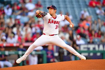 Jul 7, 2025; Anaheim, California, USA; Los Angeles Angels pitcher Yusei Kikuchi (16) throws against the Texas Rangers during the first inning at Angel Stadium. Mandatory Credit: Gary A. Vasquez-Imagn Images