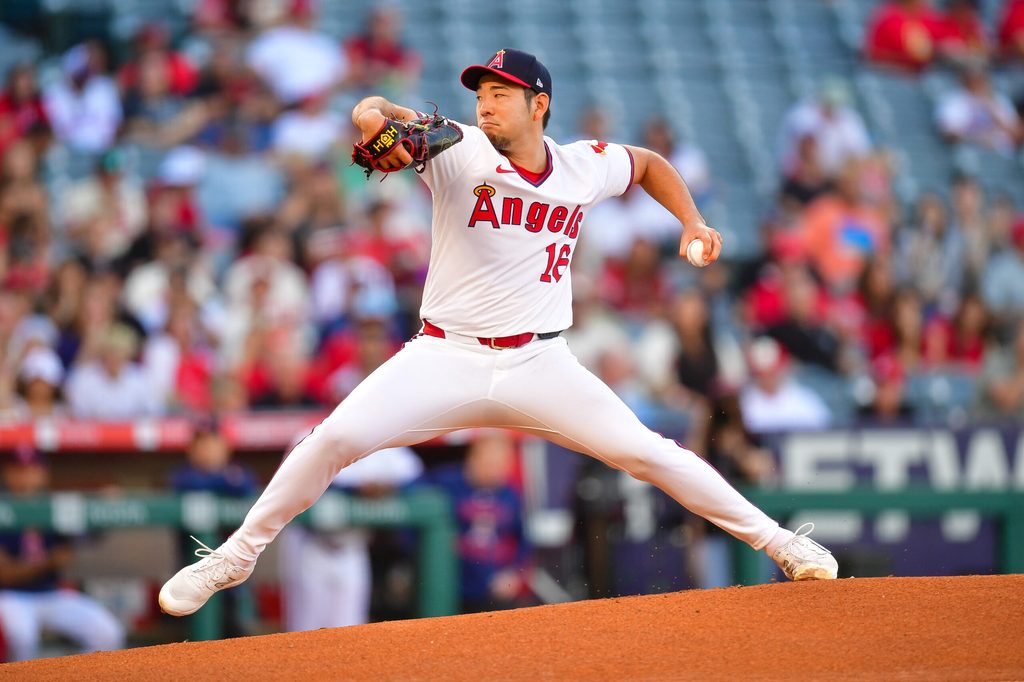 Jul 7, 2025; Anaheim, California, USA; Los Angeles Angels pitcher Yusei Kikuchi (16) throws against the Texas Rangers during the first inning at Angel Stadium. Mandatory Credit: Gary A. Vasquez-Imagn Images