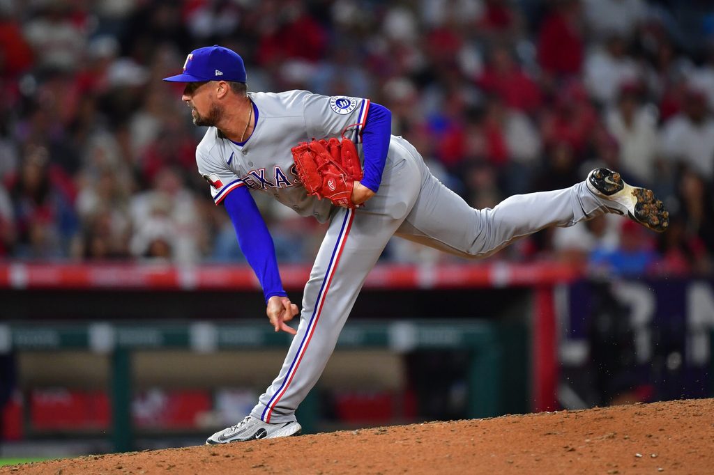 Jul 7, 2025; Anaheim, California, USA; Texas Rangers pitcher Shawn Armstrong (43) throws against the Los Angeles Angels during the sixth inning at Angel Stadium. Mandatory Credit: Gary A. Vasquez-Imagn Images