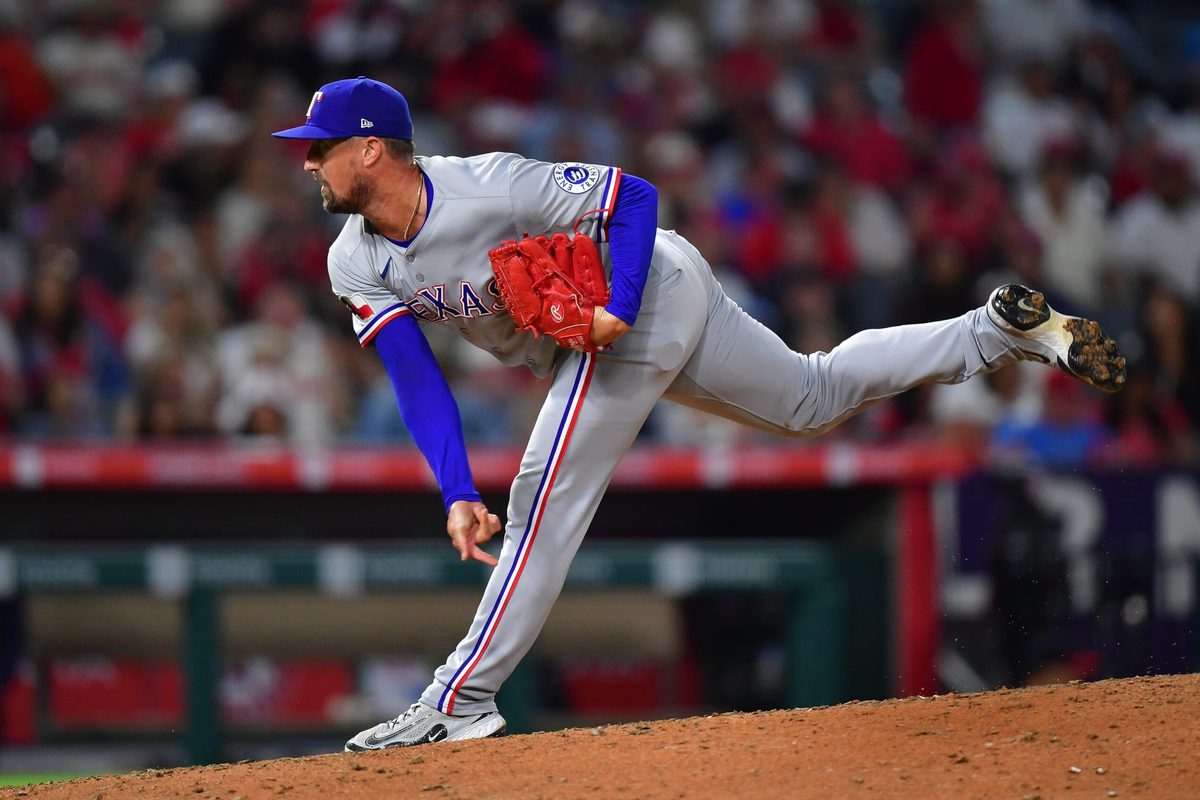 Jul 7, 2025; Anaheim, California, USA; Texas Rangers pitcher Shawn Armstrong (43) throws against the Los Angeles Angels during the sixth inning at Angel Stadium. Mandatory Credit: Gary A. Vasquez-Imagn Images
