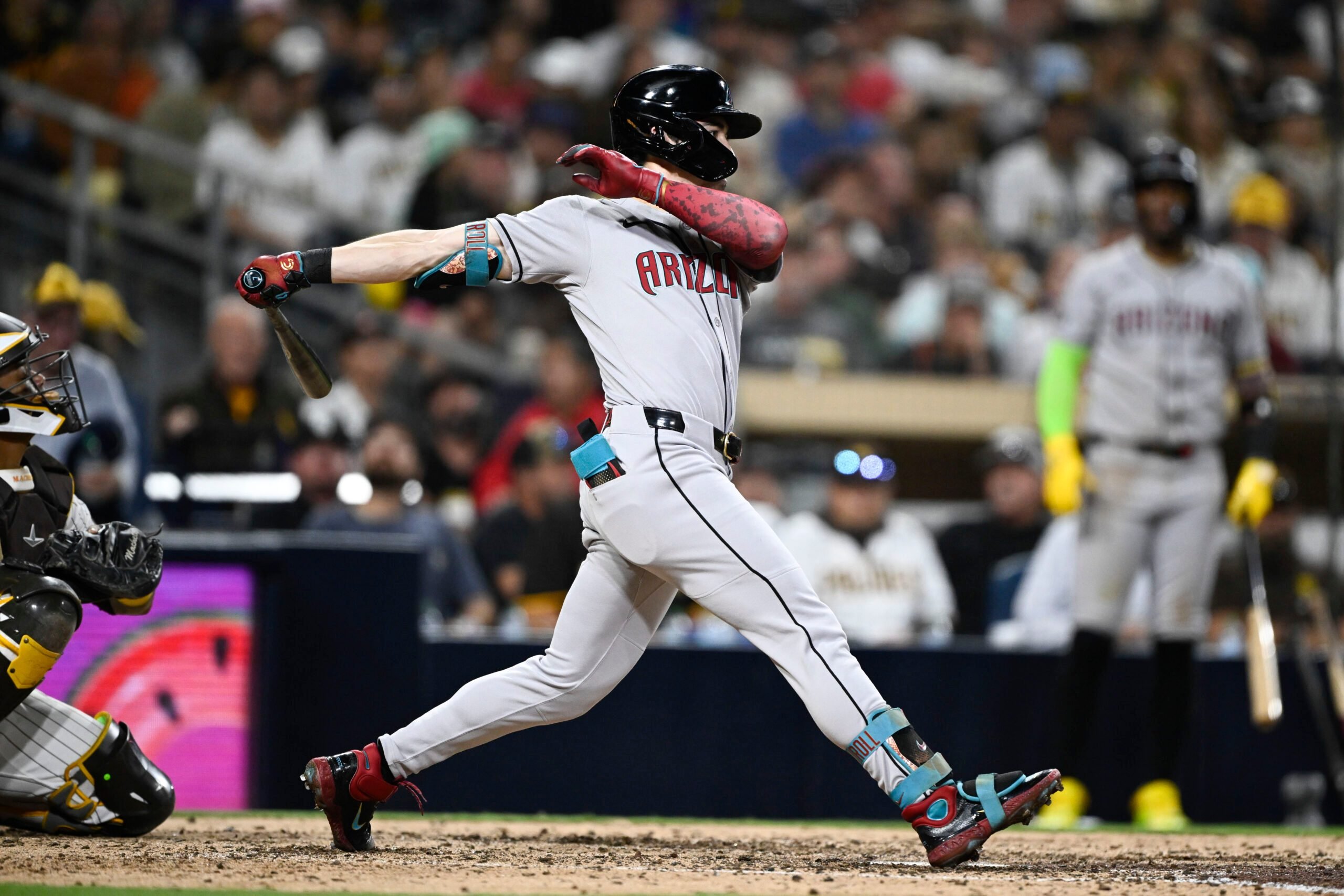 July 7, 2025; San Diego, California, USA; Arizona Diamondbacks right fielder Corbin Carroll (7) hits a triple during the eighth inning against the San Diego Padres at Petco Park. Mandatory Credit: Denis Poroy-Imagn Images