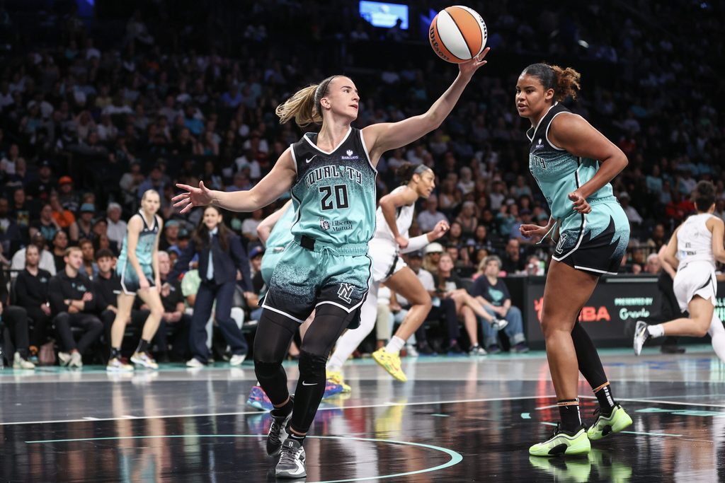 Jul 8, 2025; Brooklyn, New York, USA; New York Liberty guard Sabrina Ionescu (20) grabs a rebound in the first quarter against the Las Vegas Aces at Barclays Center. Mandatory Credit: Wendell Cruz-Imagn Images