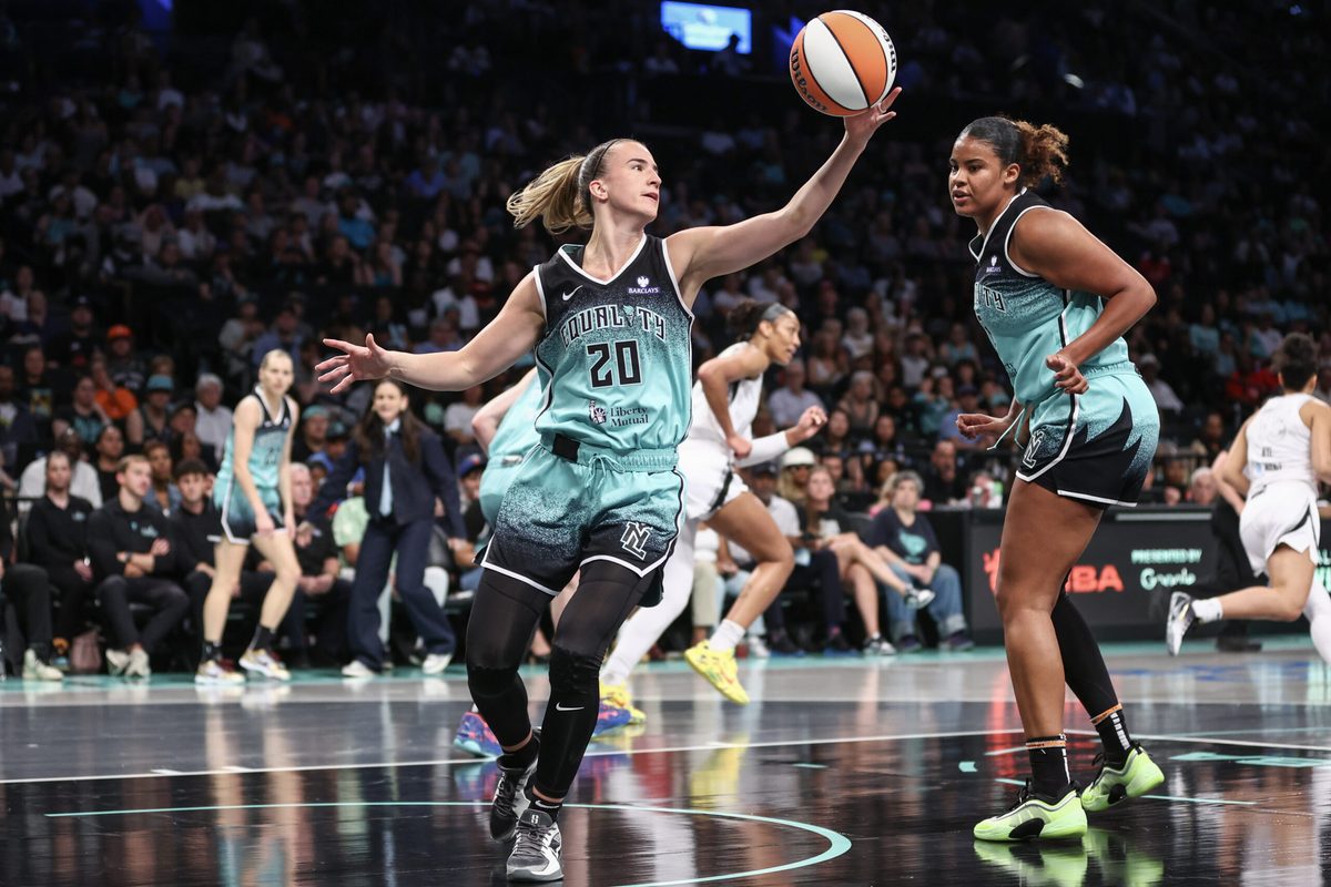 Jul 8, 2025; Brooklyn, New York, USA; New York Liberty guard Sabrina Ionescu (20) grabs a rebound in the first quarter against the Las Vegas Aces at Barclays Center. Mandatory Credit: Wendell Cruz-Imagn Images
