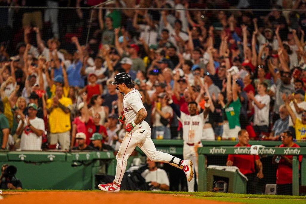 Jul 8, 2025; Boston, Massachusetts, USA; Boston Red Sox outfielder Jarren Duran (16) hits a home run against the Colorado Rockies in the seventh inning at Fenway Park. Mandatory Credit: David Butler II-Imagn Images
