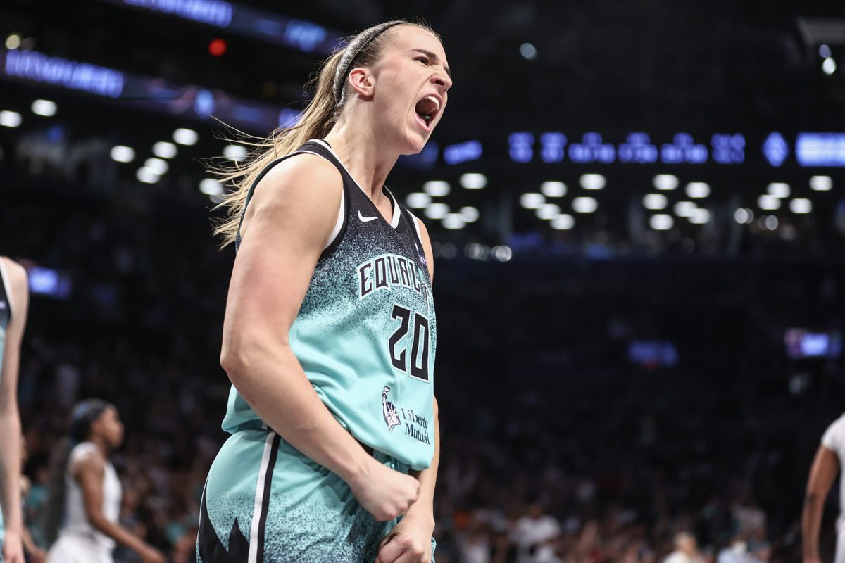 Jul 8, 2025; Brooklyn, New York, USA; New York Liberty guard Sabrina Ionescu (20) celebrates after scoring in the fourth quarter against the Las Vegas Aces at Barclays Center. Mandatory Credit: Wendell Cruz-Imagn Images