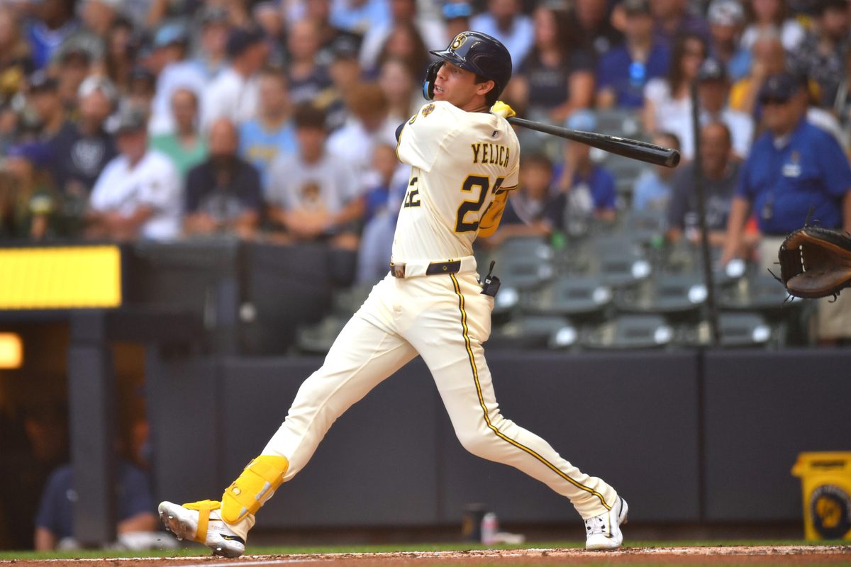 Jul 9, 2025; Milwaukee, Wisconsin, USA; Milwaukee Brewers designated hitter Christian Yelich (22) hits a single during the second inning against the Los Angeles Dodgers at American Family Field. Mandatory Credit: Patrick Gorski-Imagn Images
