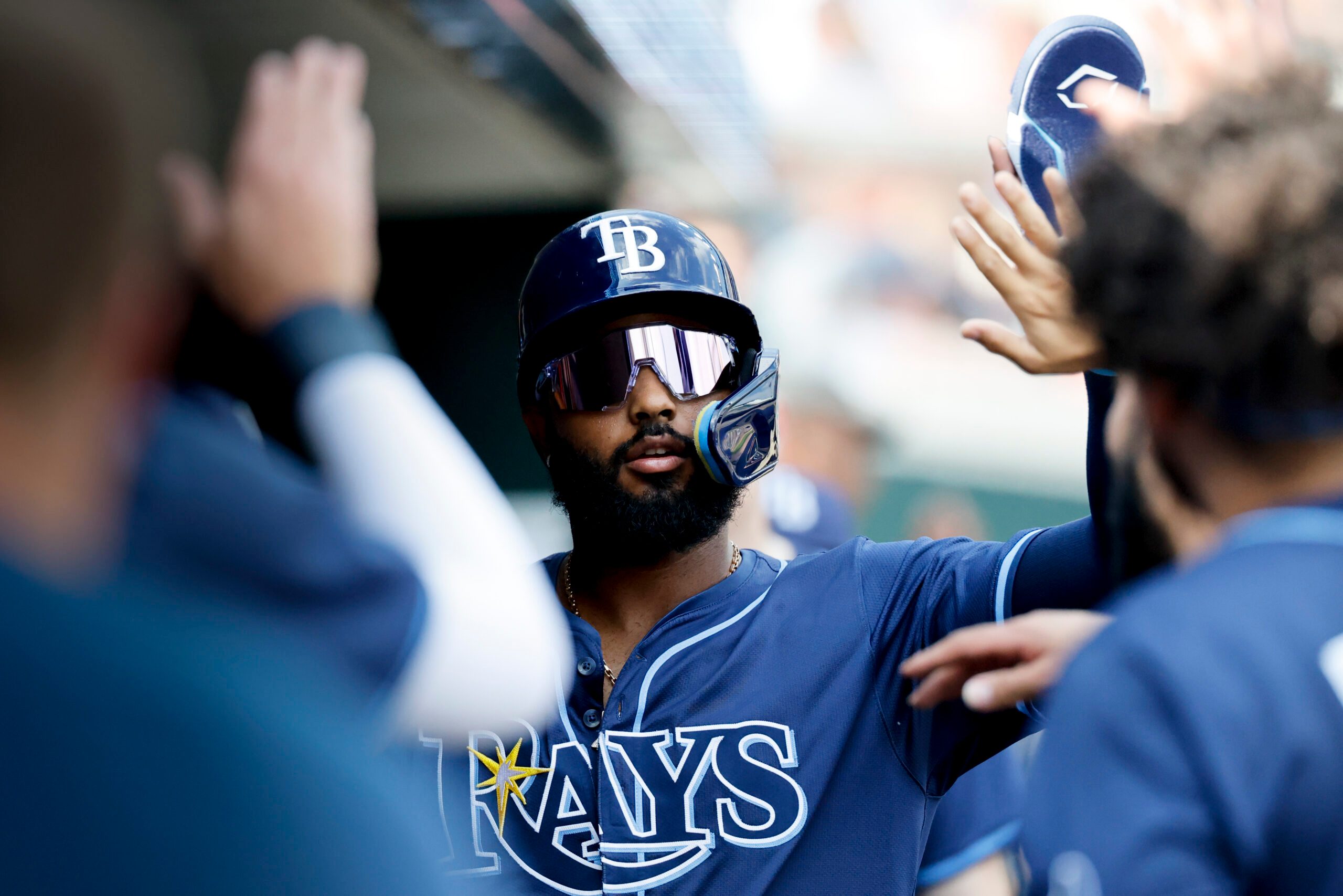 Jul 9, 2025; Detroit, Michigan, USA; Tampa Bay Rays third baseman Junior Caminero (13) receives congratulations from teammates after scoring in the first inning against the Detroit Tigers at Comerica Park. Mandatory Credit: Rick Osentoski-Imagn Images