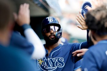 Jul 9, 2025; Detroit, Michigan, USA;  Tampa Bay Rays third baseman Junior Caminero (13) receives congratulations from teammates after scoring in the first inning against the Detroit Tigers at Comerica Park. Mandatory Credit: Rick Osentoski-Imagn Images