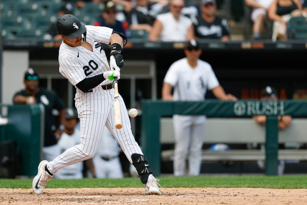 Jul 9, 2025; Chicago, Illinois, USA; Chicago White Sox third baseman Miguel Vargas (20) singles against the Toronto Blue Jays during the eight inning at Rate Field. Mandatory Credit: Kamil Krzaczynski-Imagn Images