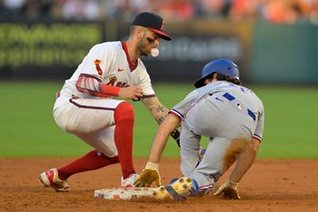 Jul 9, 2025; Anaheim, California, USA;  Texas Rangers shortstop Josh Smith (8) beats the tag by Los Angeles Angels shortstop Zach Neto (9) for a stolen base in the fourth inning at Angel Stadium. Mandatory Credit: Jayne Kamin-Oncea-Imagn Images