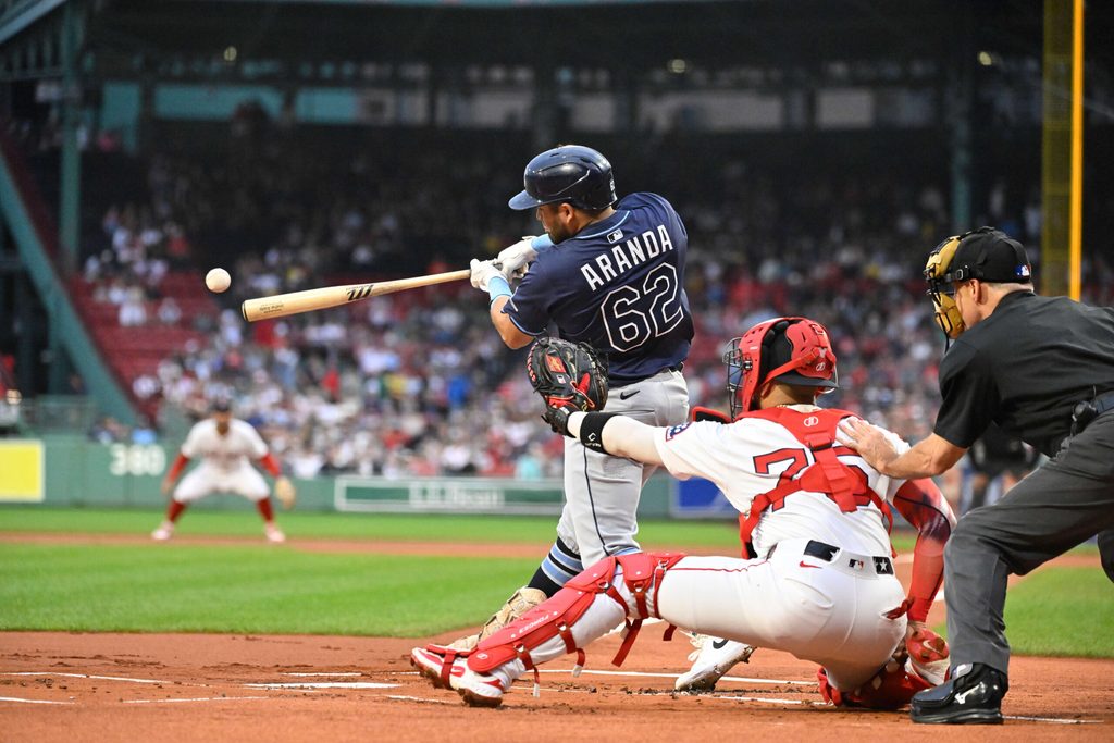 Jul 10, 2025; Boston, Massachusetts, USA; Tampa Bay Rays first baseman Jonathan Aranda (62) hits a single against the Boston Red Sox during the first inning at Fenway Park. Mandatory Credit: Eric Canha-Imagn Images