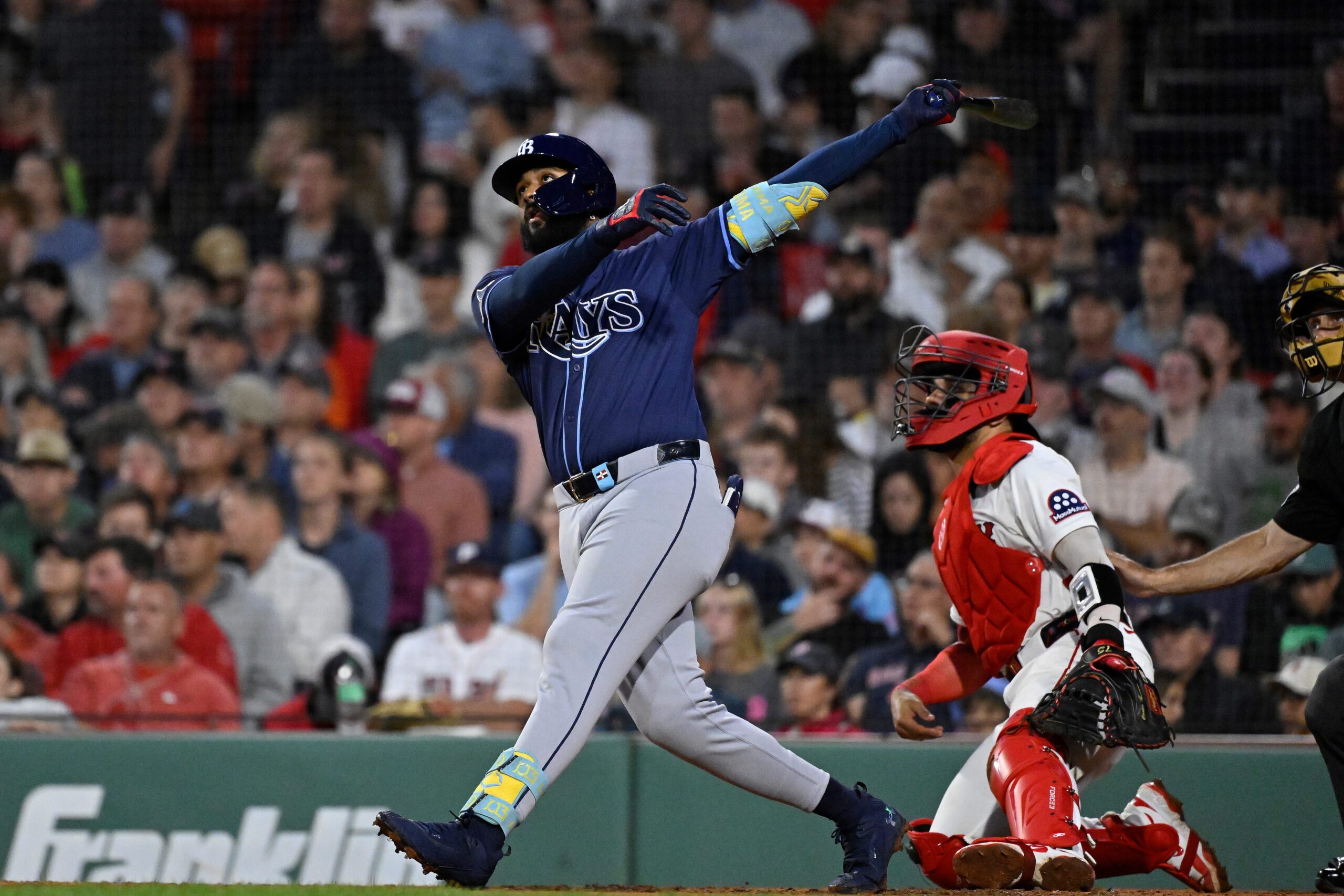 Jul 10, 2025; Boston, Massachusetts, USA; Tampa Bay Rays third baseman Junior Caminero (13) hits a home run against the Boston Red Sox during the sixth inning at Fenway Park. Mandatory Credit: Eric Canha-Imagn Images
