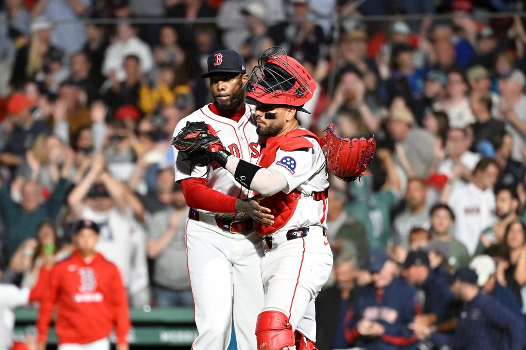 Jul 10, 2025; Boston, Massachusetts, USA; Boston Red Sox relief pitcher Aroldis Chapman (44) and catcher Carlos Narvaez (75) celebrate beating the Tampa Bay Rays at Fenway Park. Mandatory Credit: Eric Canha-Imagn Images