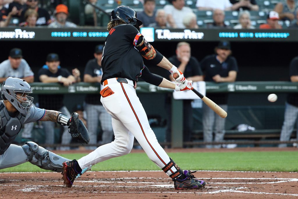 Jul 11, 2025; Baltimore, Maryland, USA; Baltimore Orioles shortstop Gunnar Henderson (2) hits a single during the third inning against the Miami Marlins at Oriole Park at Camden Yards. Mandatory Credit: Daniel Kucin Jr.-Imagn Images