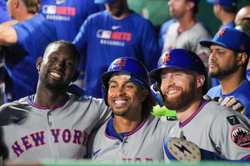 Jul 11, 2025; Kansas City, Missouri, USA; New York Mets third baseman Ronny Mauricio (10) and shortstop Francisco Lindor (12) and left fielder Brandon Nimmo (9) pose for a photo after scoring against the Kansas City Royals in the ninth inning at Kauffman Stadium. Mandatory Credit: Denny Medley-Imagn Images