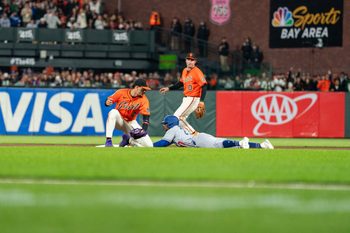 Jul 11, 2025; San Francisco, California, USA; Los Angeles Dodgers outfielder Esteury Ruiz (27) steals second base against San Francisco Giants shortstop Willy Adames (2) during the ninth inning at Oracle Park. Mandatory Credit: Neville E. Guard-Imagn Images