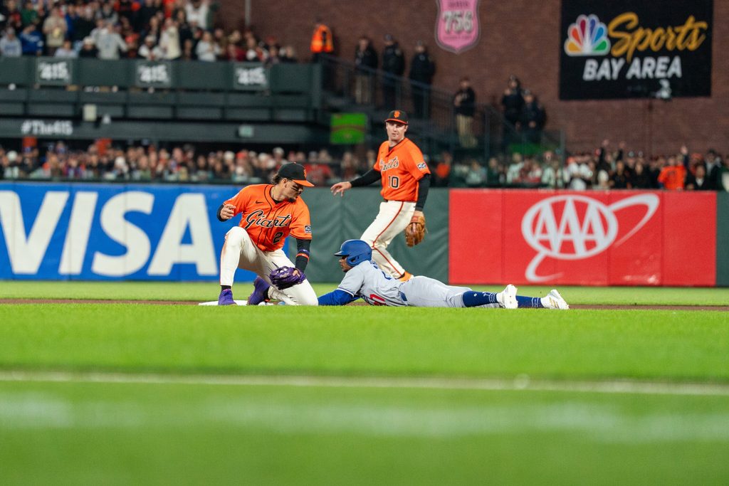 Jul 11, 2025; San Francisco, California, USA; Los Angeles Dodgers outfielder Esteury Ruiz (27) steals second base against San Francisco Giants shortstop Willy Adames (2) during the ninth inning at Oracle Park. Mandatory Credit: Neville E. Guard-Imagn Images