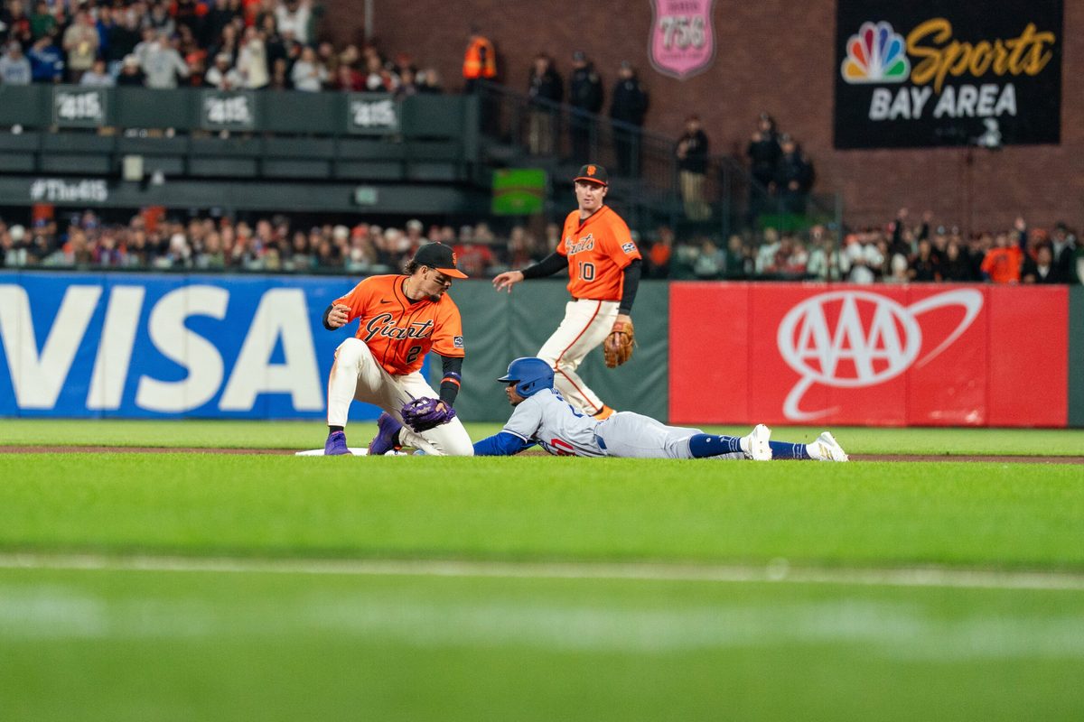 Jul 11, 2025; San Francisco, California, USA; Los Angeles Dodgers outfielder Esteury Ruiz (27) steals second base against San Francisco Giants shortstop Willy Adames (2) during the ninth inning at Oracle Park. Mandatory Credit: Neville E. Guard-Imagn Images