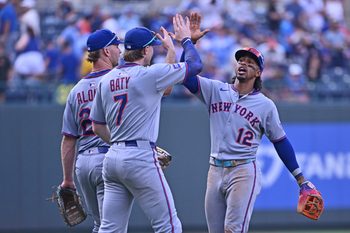 Jul 12, 2025; Kansas City, Missouri, USA;  New York Mets shortstop Francisco Lindor (12) celebrates with teammates second baseman Brett Baty (7) and first baseman Pete Alonso (20) after beating the Kansas City Royals at Kauffman Stadium. Mandatory Credit: Peter Aiken-Imagn Images