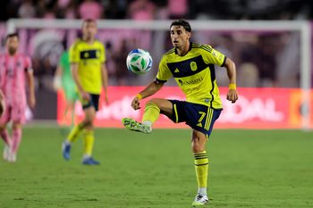 Jul 12, 2025; Fort Lauderdale, Florida, USA; Nashville SC midfielder Gaston Brugman (7) controls the ball against Inter Miami CF during the second half at Chase Stadium. Mandatory Credit: Sam Navarro-Imagn Images