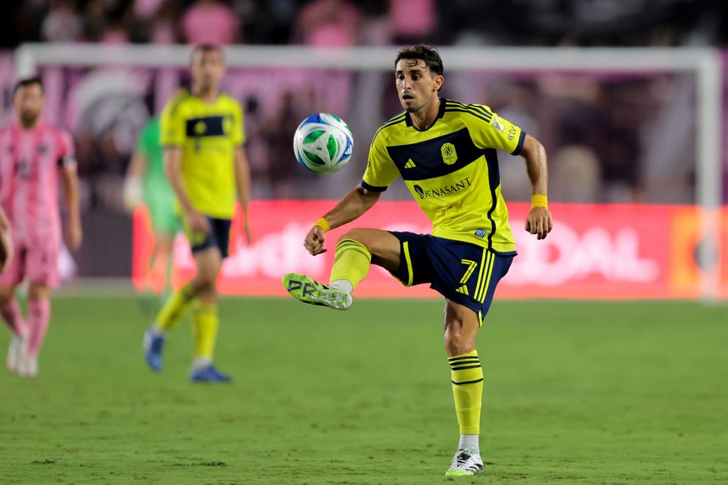 Jul 12, 2025; Fort Lauderdale, Florida, USA; Nashville SC midfielder Gaston Brugman (7) controls the ball against Inter Miami CF during the second half at Chase Stadium. Mandatory Credit: Sam Navarro-Imagn Images