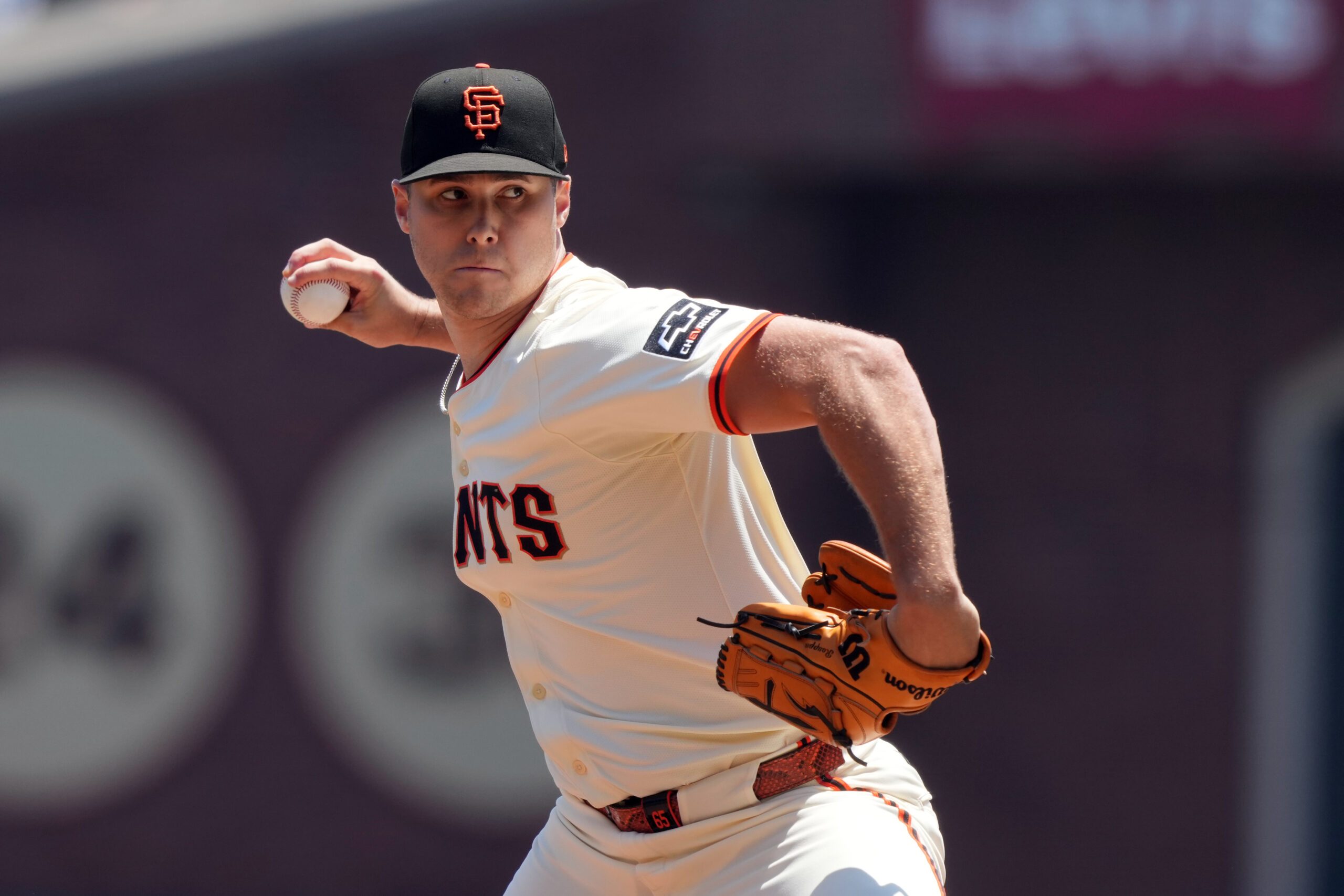 Jul 12, 2025; San Francisco, California, USA; San Francisco Giants starting pitcher Landen Roupp (65) throws a pitch against the Los Angeles Dodgers during the first inning at Oracle Park. Mandatory Credit: Darren Yamashita-Imagn Images