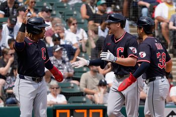 Jul 13, 2025; Chicago, Illinois, USA; Cleveland Guardians first base Kyle Manzardo (C) is greeted by  third baseman José Ramírez (L) and outfielder Steven Kwan (38) after hits a three-run home run against the Chicago White Sox during the sixth inning at Rate Field. Mandatory Credit: David Banks-Imagn Images