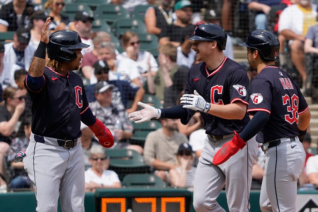 Jul 13, 2025; Chicago, Illinois, USA; Cleveland Guardians first base Kyle Manzardo (C) is greeted by  third baseman José Ramírez (L) and outfielder Steven Kwan (38) after hits a three-run home run against the Chicago White Sox during the sixth inning at Rate Field. Mandatory Credit: David Banks-Imagn Images