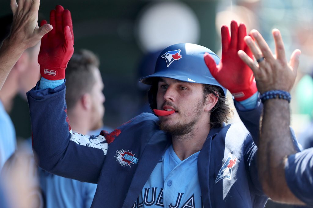 Jul 13, 2025; West Sacramento, California, USA; Toronto Blue Jays third baseman Addison Barger (47) celebrates with teammates after hitting a two-run home run against the Athletics during the seventh inning at Sutter Health Park. Mandatory Credit: Dennis Lee-Imagn Images