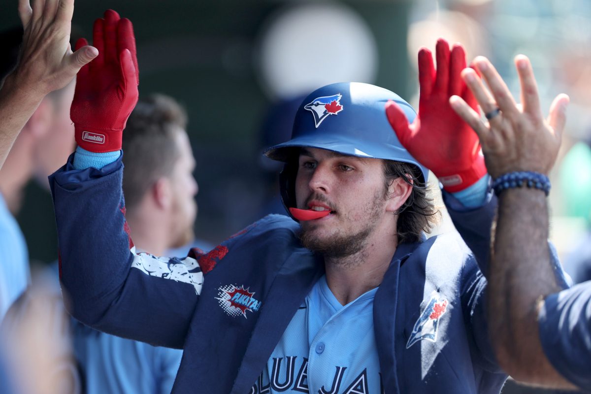 Jul 13, 2025; West Sacramento, California, USA; Toronto Blue Jays third baseman Addison Barger (47) celebrates with teammates after hitting a two-run home run against the Athletics during the seventh inning at Sutter Health Park. Mandatory Credit: Dennis Lee-Imagn Images