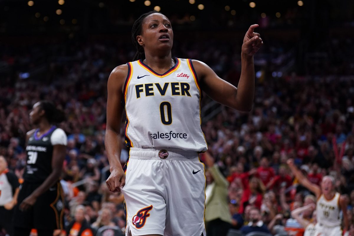 Jul 15, 2025; Boston, Massachusetts, USA; Indiana Fever guard Kelsey Mitchell (0) reacts after her basket and being fouled by the Connecticut Sun in the first quarter at TD Garden. Mandatory Credit: David Butler II-Imagn Images