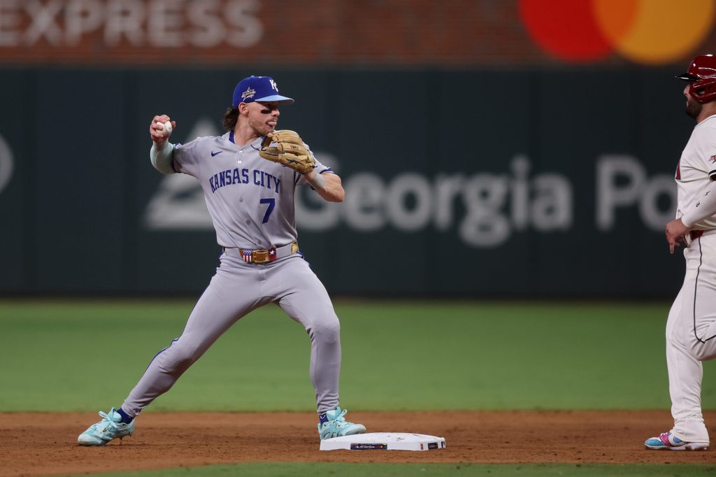 Jul 15, 2025; Cumberland, Georgia, USA; American League shortstop Bobby Witt Jr. (7) of the Kansas City Royals forces out National League first baseman Matt Olson (28) of the Atlanta Braves in the eighth inning during the 2025 MLB All Star Game at Truist Park. Mandatory Credit: Brett Davis-Imagn Images