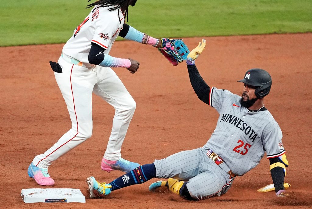 Jul 15, 2025; Cumberland, Georgia, USA; American League outfielder Byron Buxton (25) of the Minnesota Twins slides into second base after hitting a double during the ninth inning during the 2025 MLB All Star Game at Truist Park. Mandatory Credit: Dale Zanine-Imagn Images