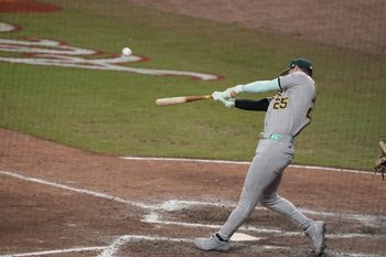 Jul 15, 2025; Cumberland, Georgia, USA; National League designated hitter Brent Rooker (25) of the Athletics hits a home run during the swing off after the 2025 MLB All Star Game ended in a tie at Truist Park. Mandatory Credit: Dale Zanine-Imagn Images