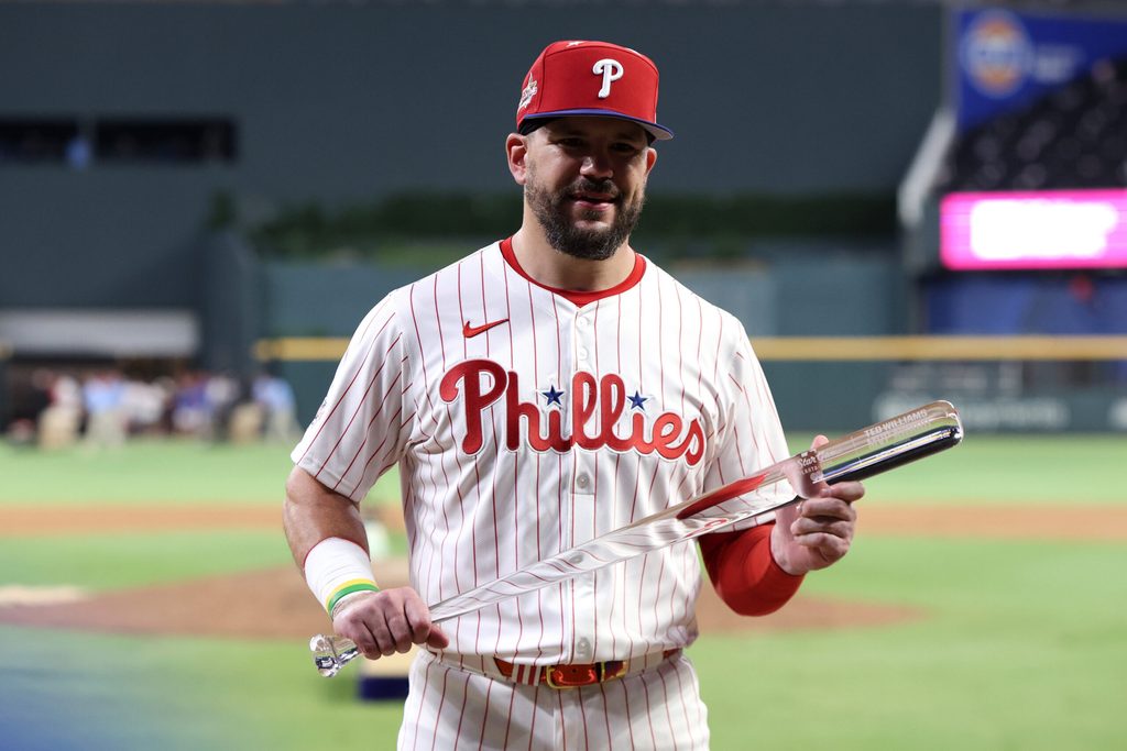 Jul 15, 2025; Cumberland, Georgia, USA; National League designated hitter Kyle Schwarber (12) of the Philadelphia Phillies celebrates with the MVP trophy after defeating the American League in the 2025 MLB All Star Game at Truist Park. Mandatory Credit: Brett Davis-Imagn Images