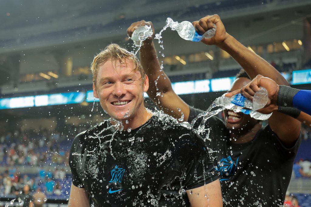 Jul 18, 2025; Miami, Florida, USA; Miami Marlins left fielder Kyle Stowers (28) is doused with water by teammates after hitting a two-run walk-off home run against the Kansas City Royals during the tenth inning at loanDepot Park. Mandatory Credit: Sam Navarro-Imagn Images