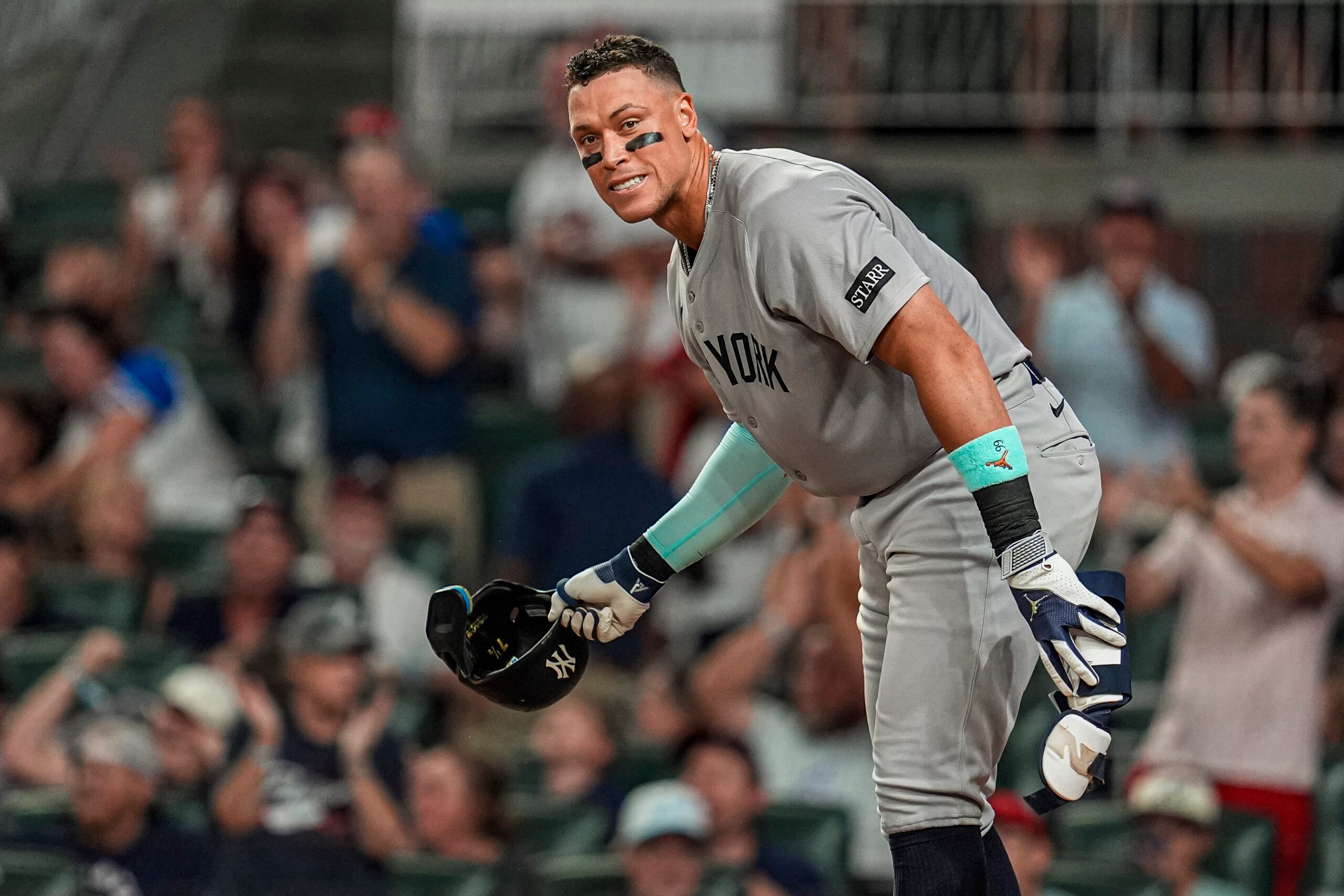 Jul 18, 2025; Cumberland, Georgia, USA; New York Yankees right fielder Aaron Judge (99) reacts after striking out against the  Atlanta Braves during the seventh inning at Truist Park. Mandatory Credit: Dale Zanine-Imagn Images