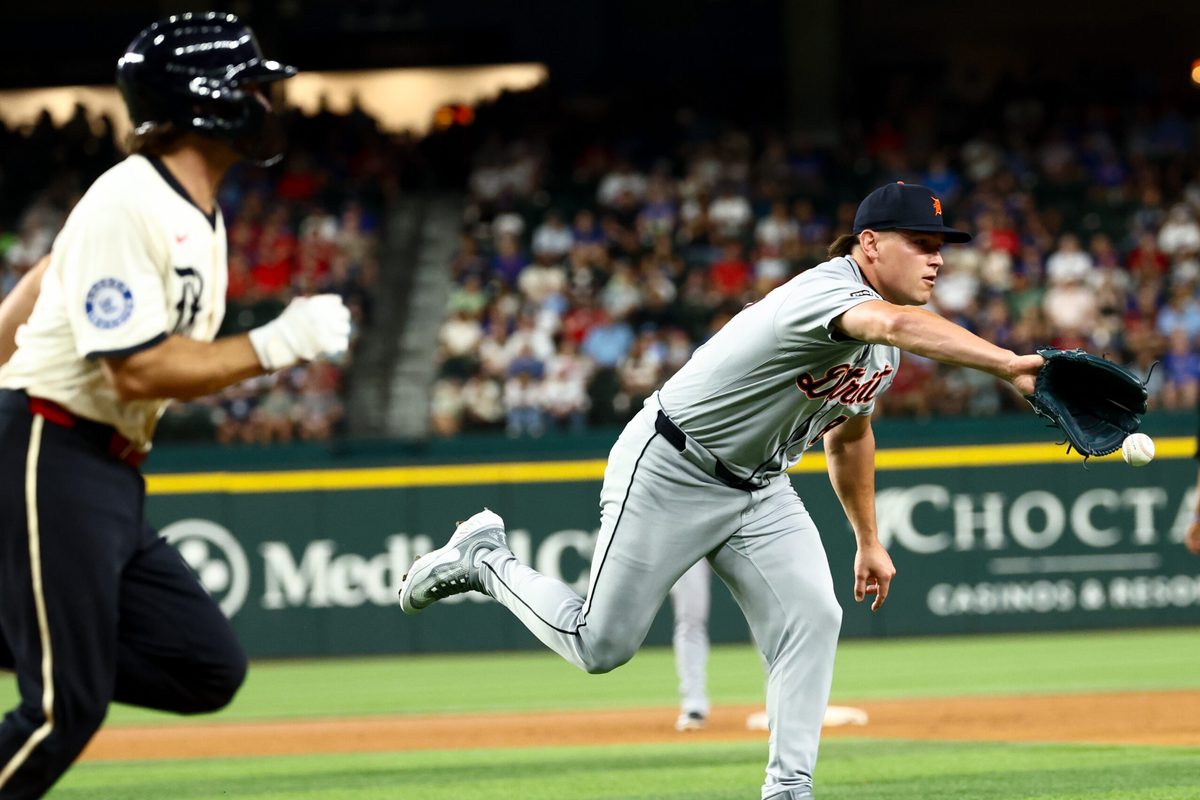 Jul 18, 2025; Arlington, Texas, USA;  Detroit Tigers relief pitcher Tyler Holton (87) pitches the ball to first base to get Texas Rangers third baseman Josh Smith (8) out during the sixth inning at Globe Life Field. Mandatory Credit: Kevin Jairaj-Imagn Images