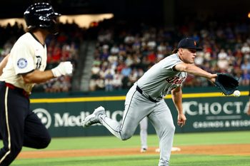 Jul 18, 2025; Arlington, Texas, USA;  Detroit Tigers relief pitcher Tyler Holton (87) pitches the ball to first base to get Texas Rangers third baseman Josh Smith (8) out during the sixth inning at Globe Life Field. Mandatory Credit: Kevin Jairaj-Imagn Images
